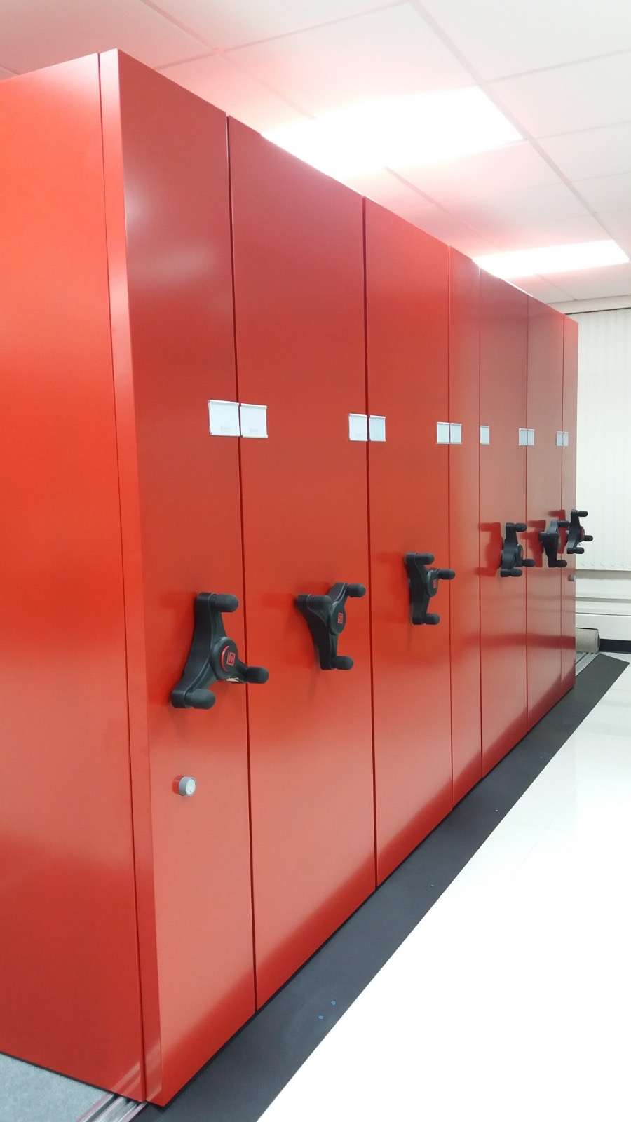 Red mobile shelving carriages